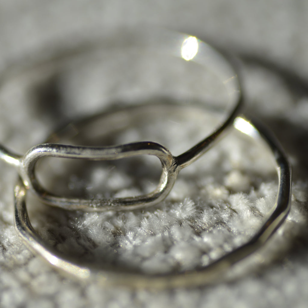 Silver ring on a textured surface